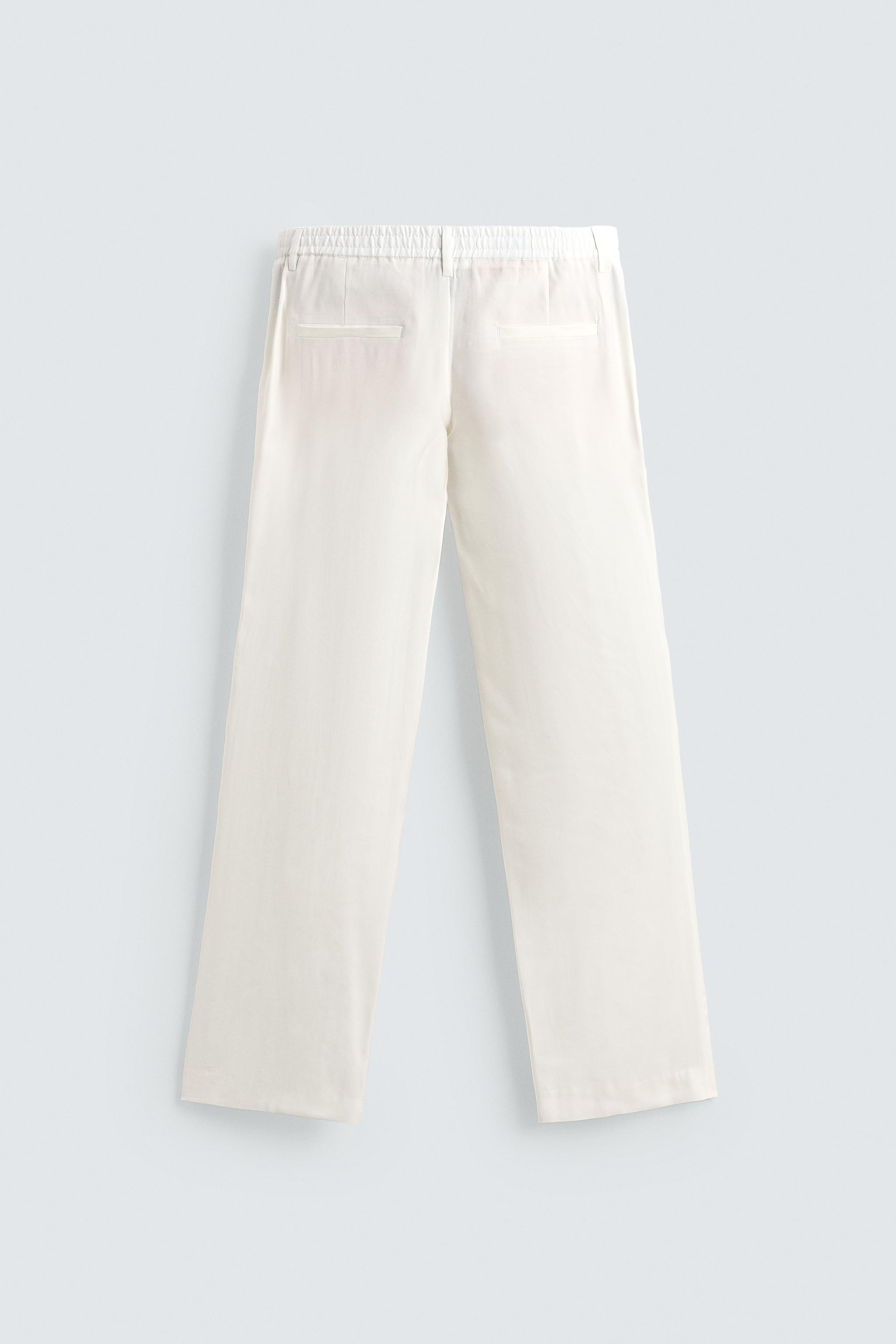RELAXED FIT PLEATED PANTS